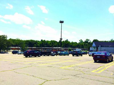 MBTA Lot: Roughly two dozen vehicles were parked in the T’s Mattapan lot early Monday afternoon. 	Lauren Dezenski photo